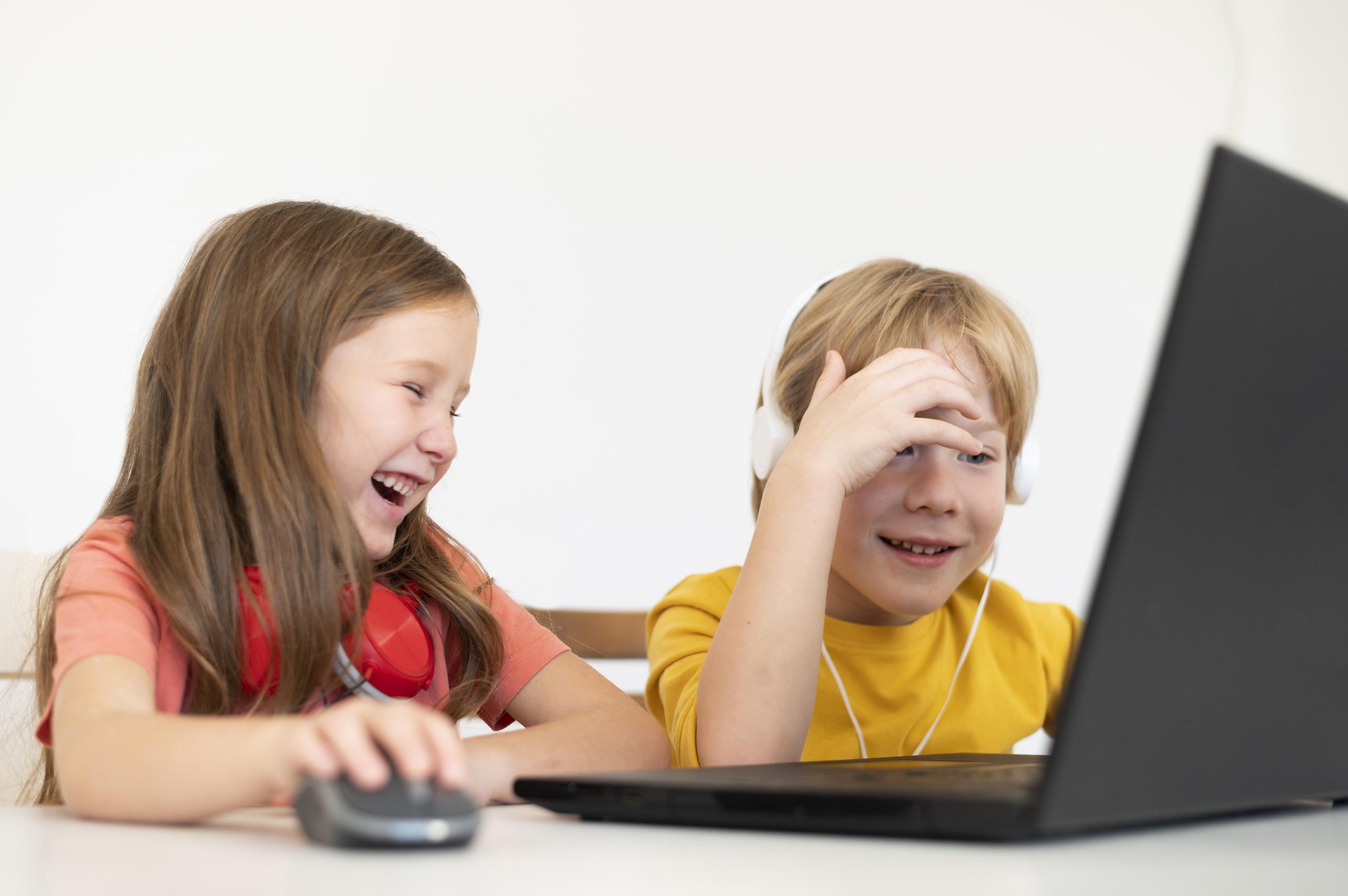 young-kids-using-laptop-together
